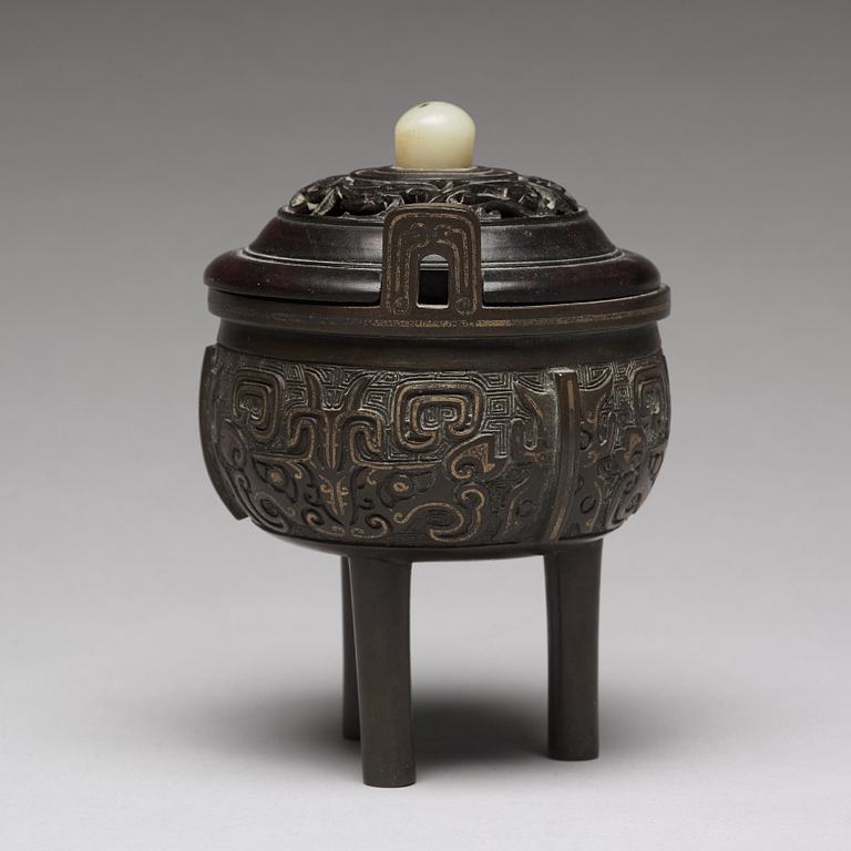 A tripod bronze censer Qing dynasty, 19th Century.