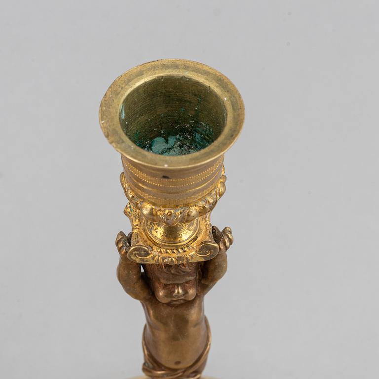 A pair of 19th Century bronze empire style candlesticks.
