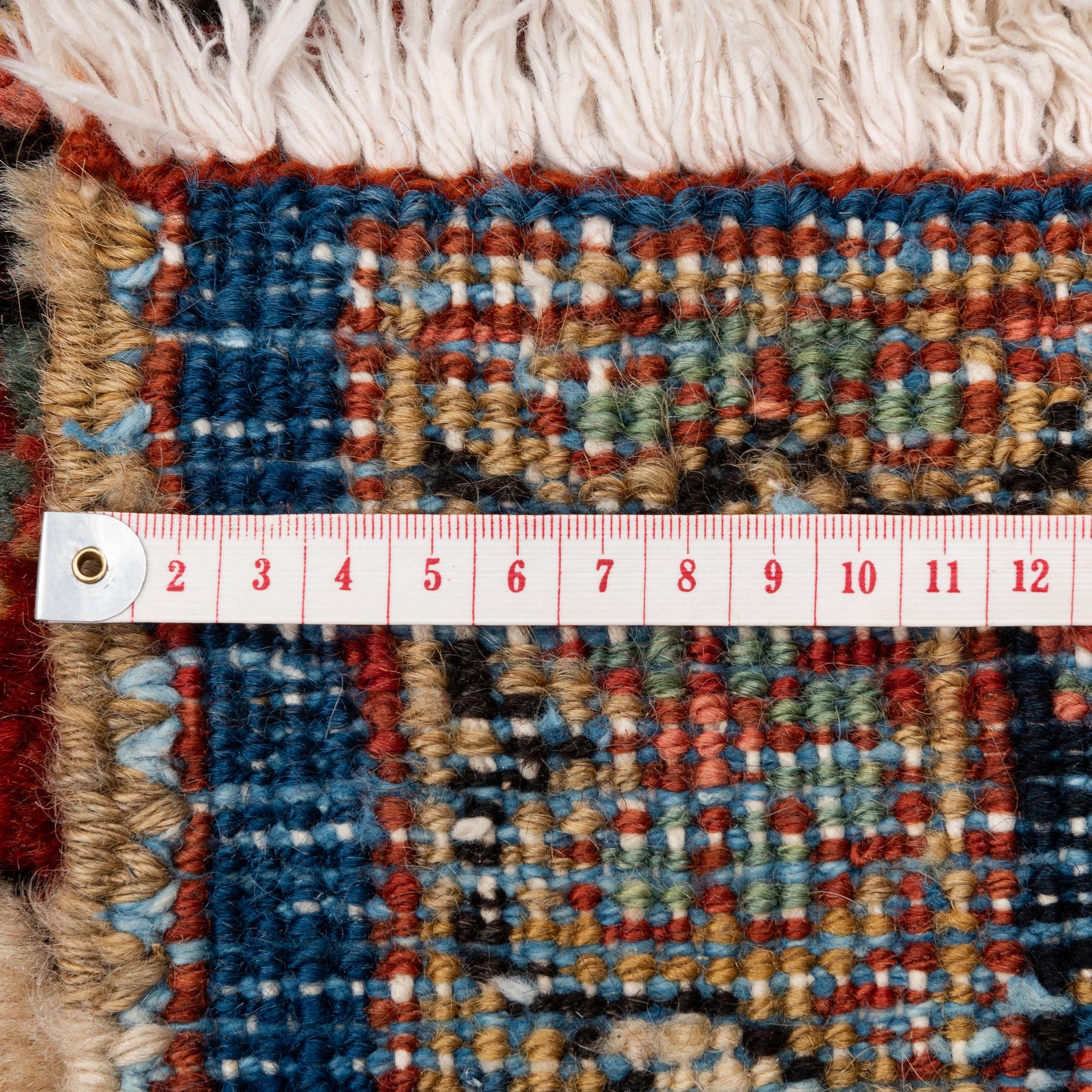 A semi-antique Heris carpet, c. 364 x 299 cm.