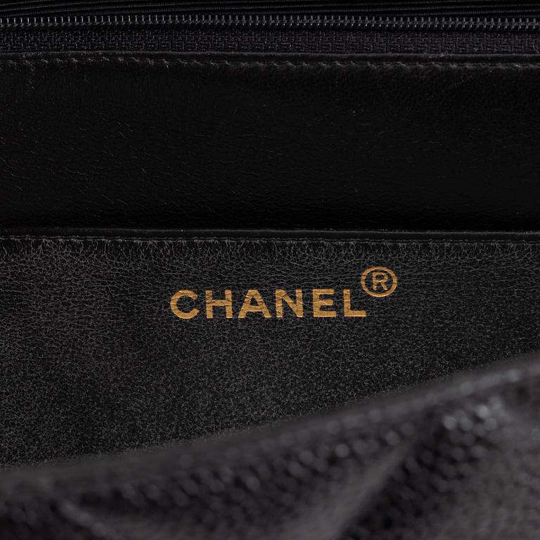 Chanel, a black caviar leather briefcase.