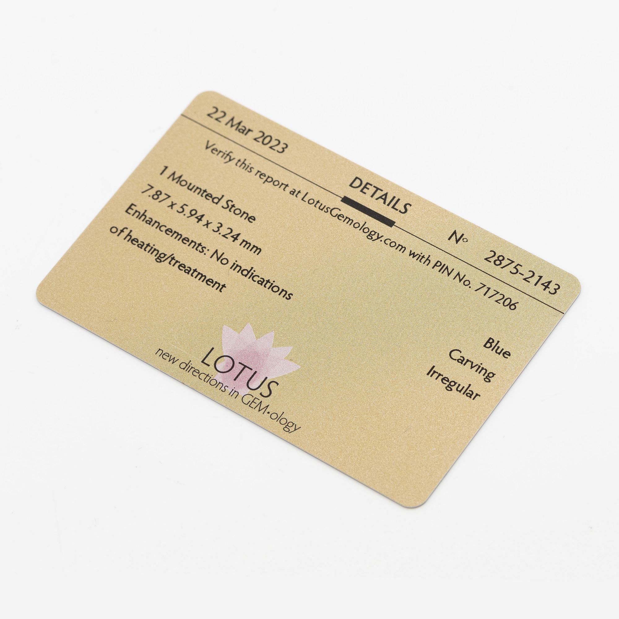 Pendant, 18K gold with carved sapphires, white sapphire, and a small rose-cut diamond.