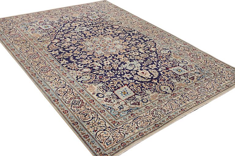 A Nain carpet, part silk, c. 338 x 244 cm.