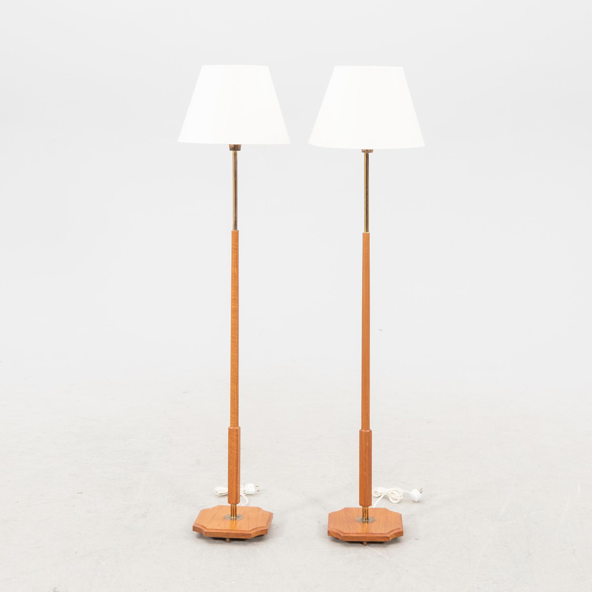 A pair of 1960s teak floor lamps.