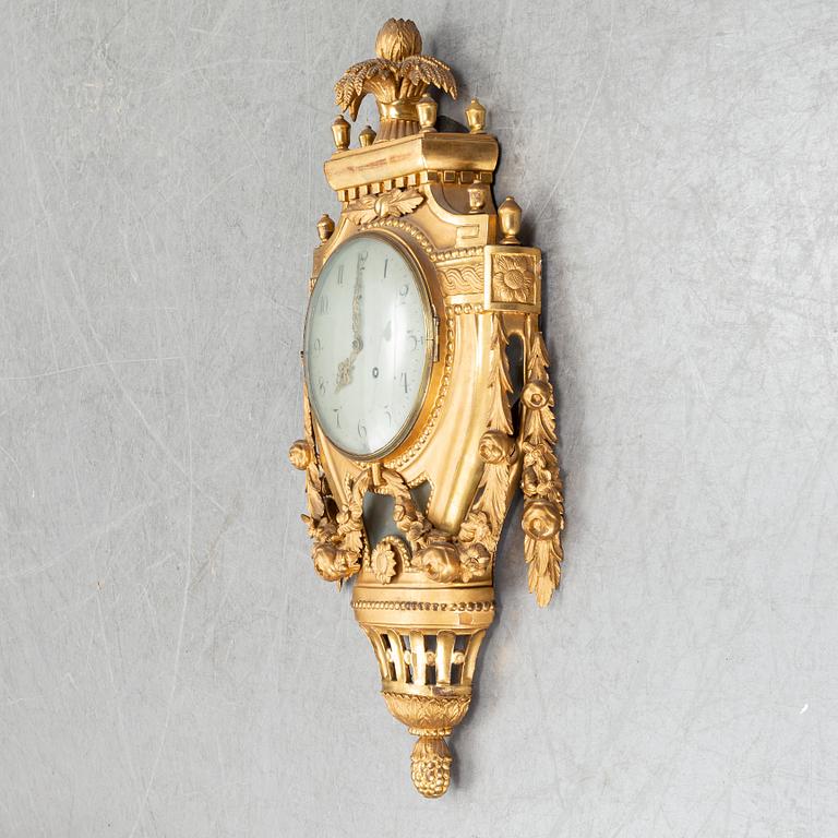 A Gustavian pendulum wall clock.