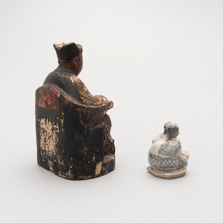 TWO FIGURINES, one possibly Chinese 19th Century and the other possibly 14th-15th Century Southeast Asian.