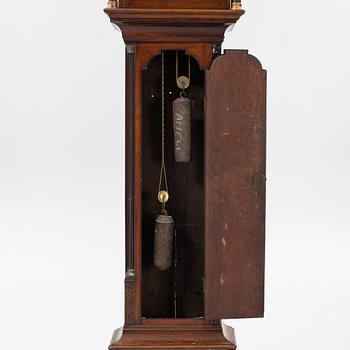 A mahogany veneered longcase clock, marked Peter Pohlmann, London, England, 18th century.