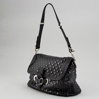 SONIA RYKIEL, a black leather bag.