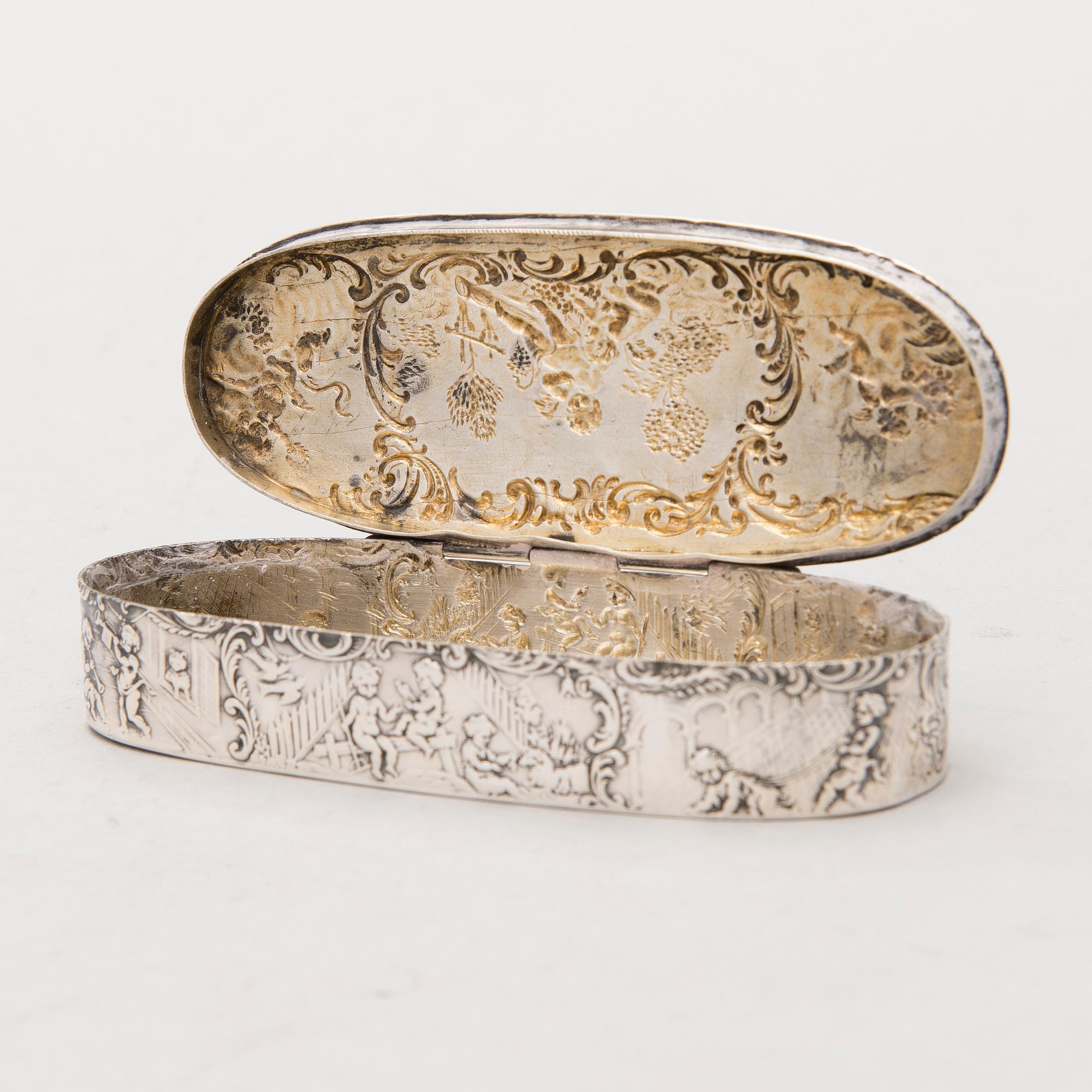 Four silver objects from the 20th Century.