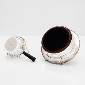 Two miniature beakers and a butter pan, Copenhagen, 1950s, and a silver-plated bottle coaster.