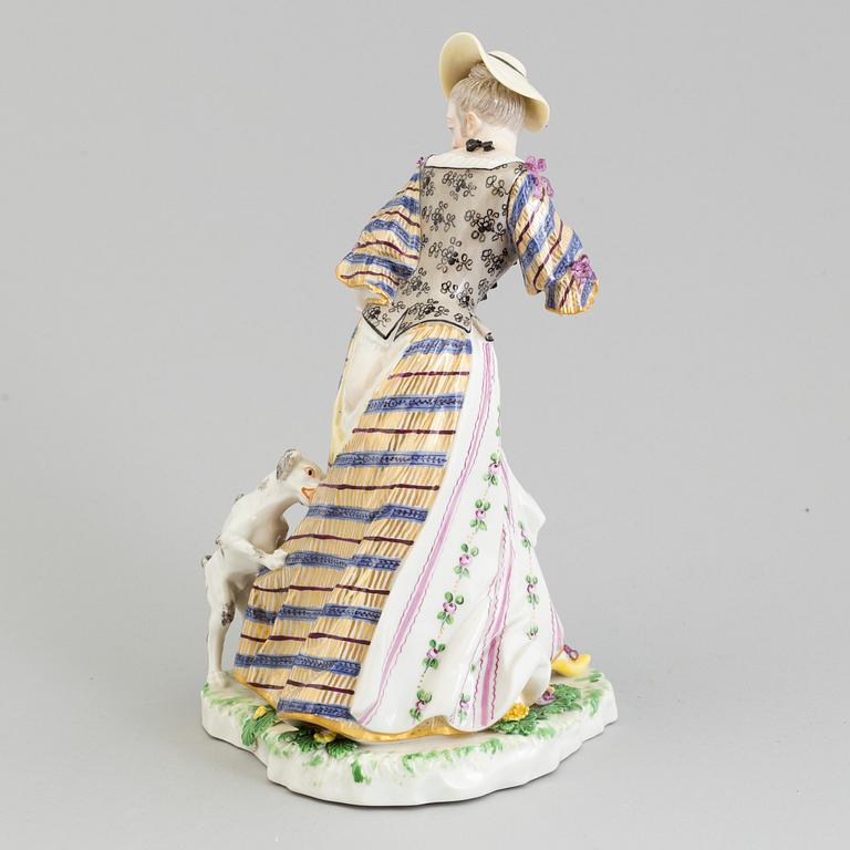 A Nymphenburg porcelain figure of a lady with a dog, Germany, 20th Century.