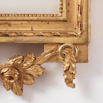 A Gustavian giltwood two-branch girandole mirror, Stockholm, late 18th century.