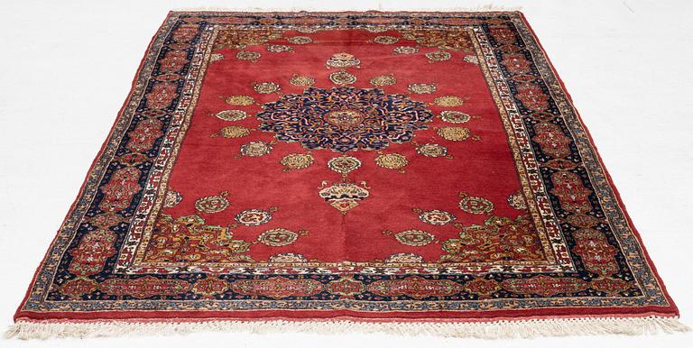 An oriental rug, c. 245 x 150 cm.