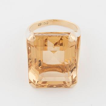 An emerald cut citrin ring.