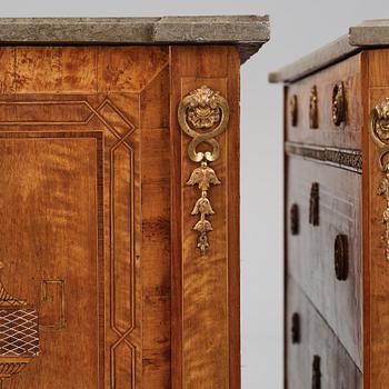 A matched pair of Gustavian ormolu-mounted limestone topped and marquetry commodes by C. Lindborg, late 18th century.