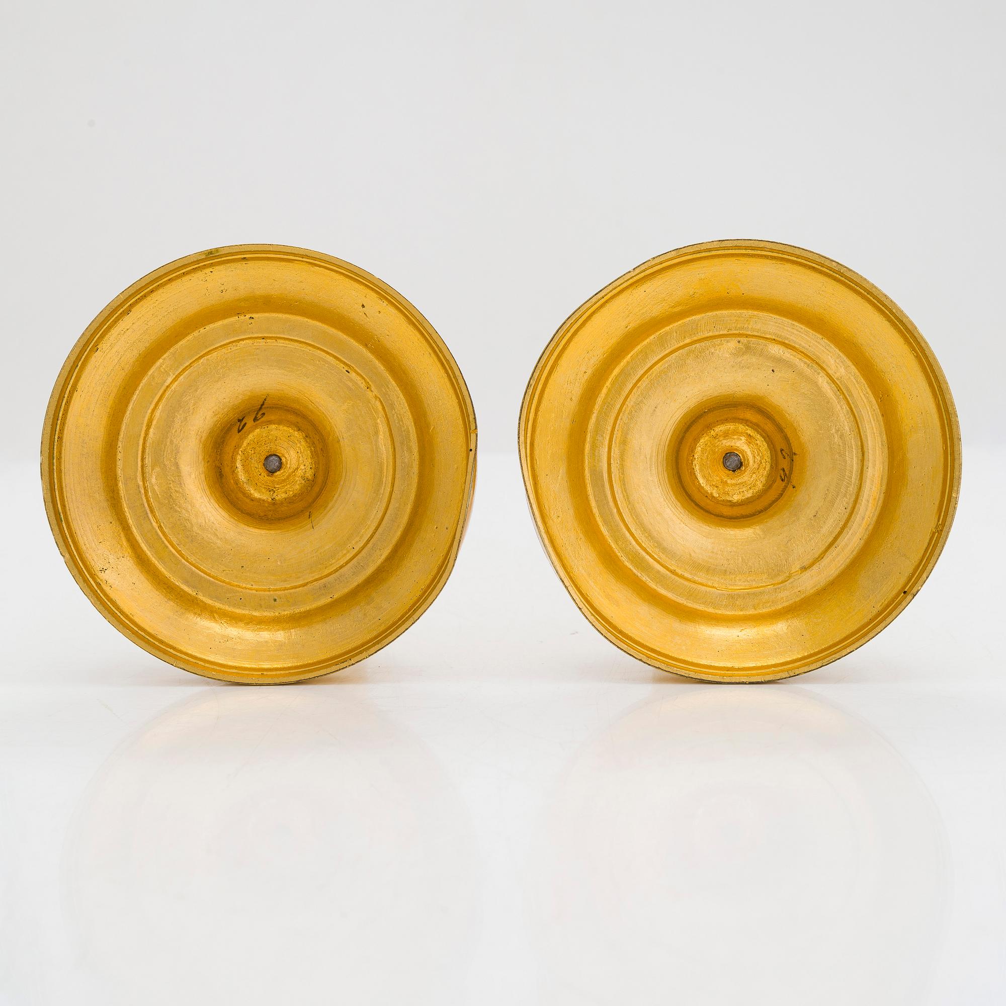 A pair of mid-19th-century gilded bronze candlesticks.
