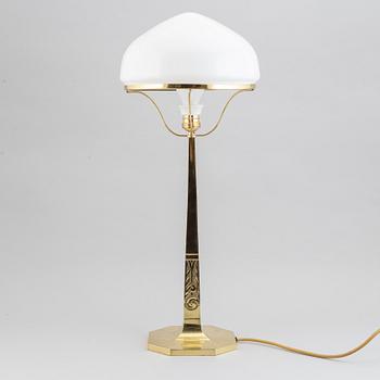 An Art Nouveau brass table lamp, early 20th century.