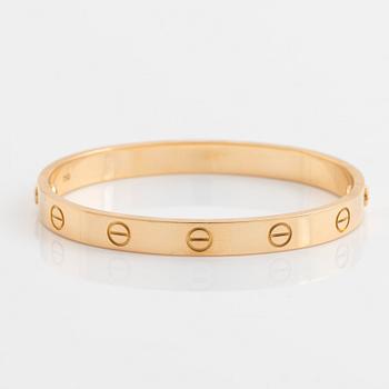 A Cartier "Love" bracelet in 18K gold.