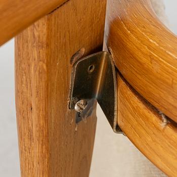 Yngve Ekström, an oak 'Lamino' easy chair with foot stool  for Swedese,