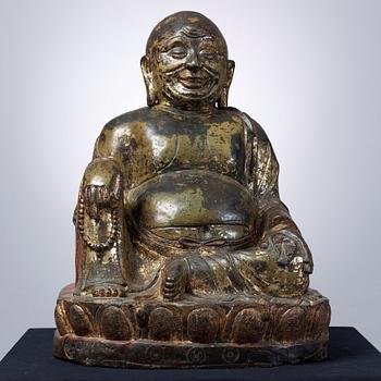 A large seated bronze figure of Budai, Ming Dynasty, dated to the fifth year of Jiajing (1526).