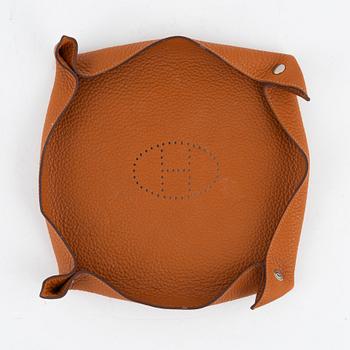Hermès, an orange Clemence 'Mises et Relances' change tray, 2012.