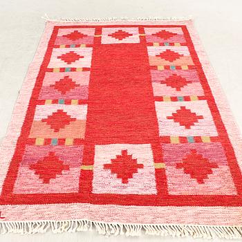 A Swedish flat weave carpet signed approx 240x169 cm.