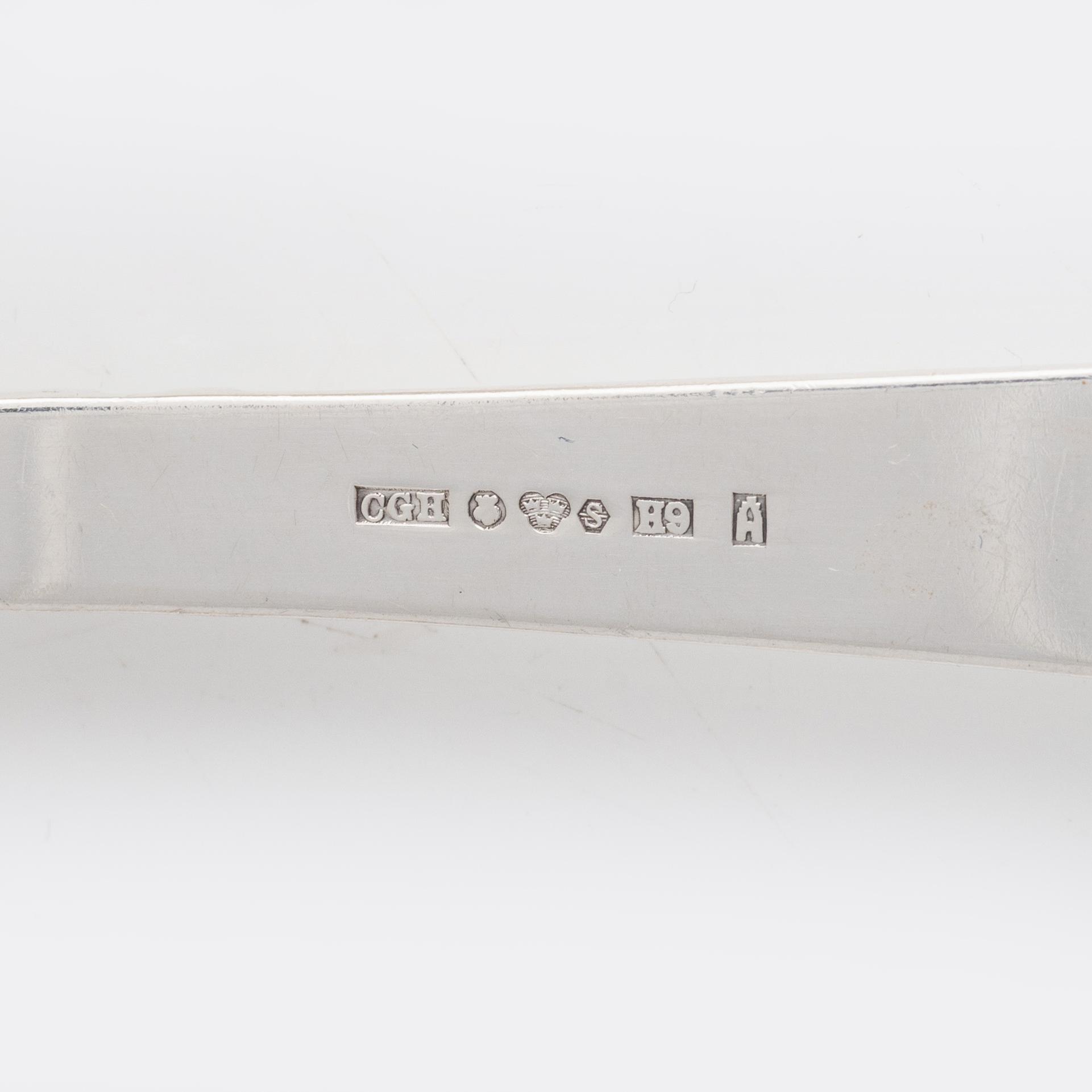 Nine pieces of silver cutlery.