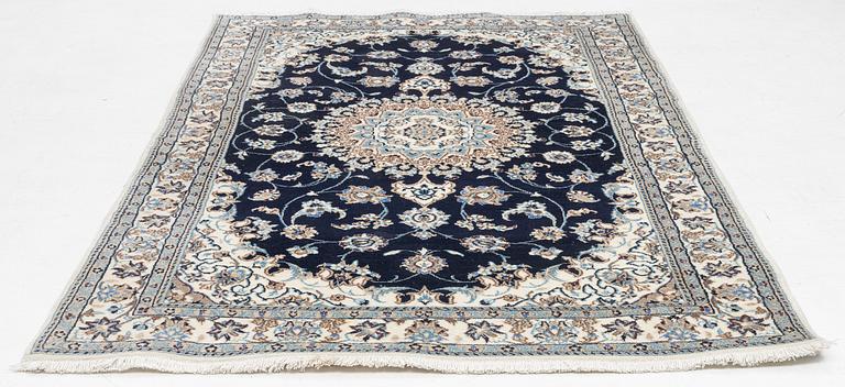 A Nain carpet, c. 255 x 150 cm.