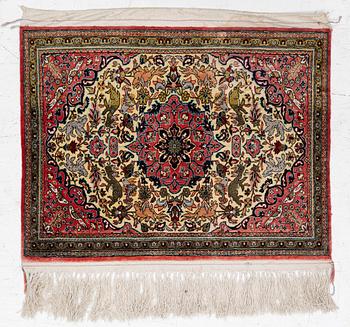 A silk Ghom rug , a. 60 x 80 cm.
