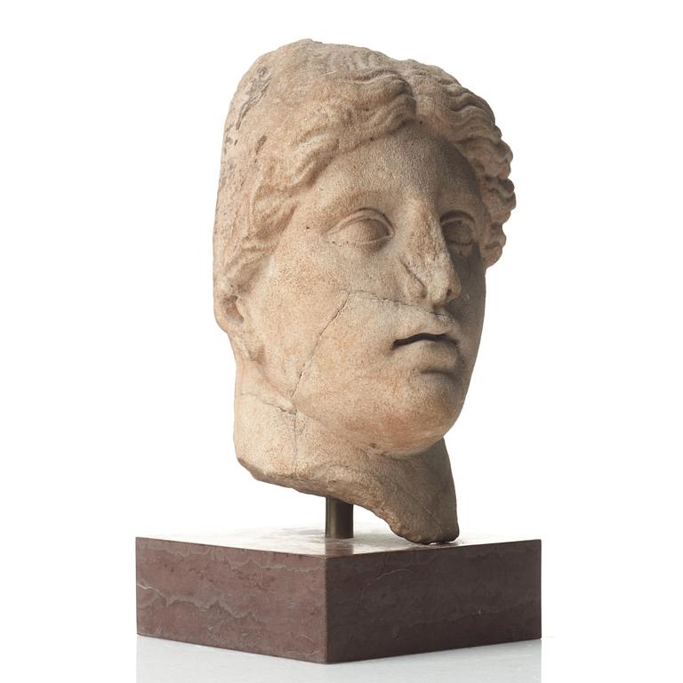 A marble head of a woman, probably Roman 100-200 AD.