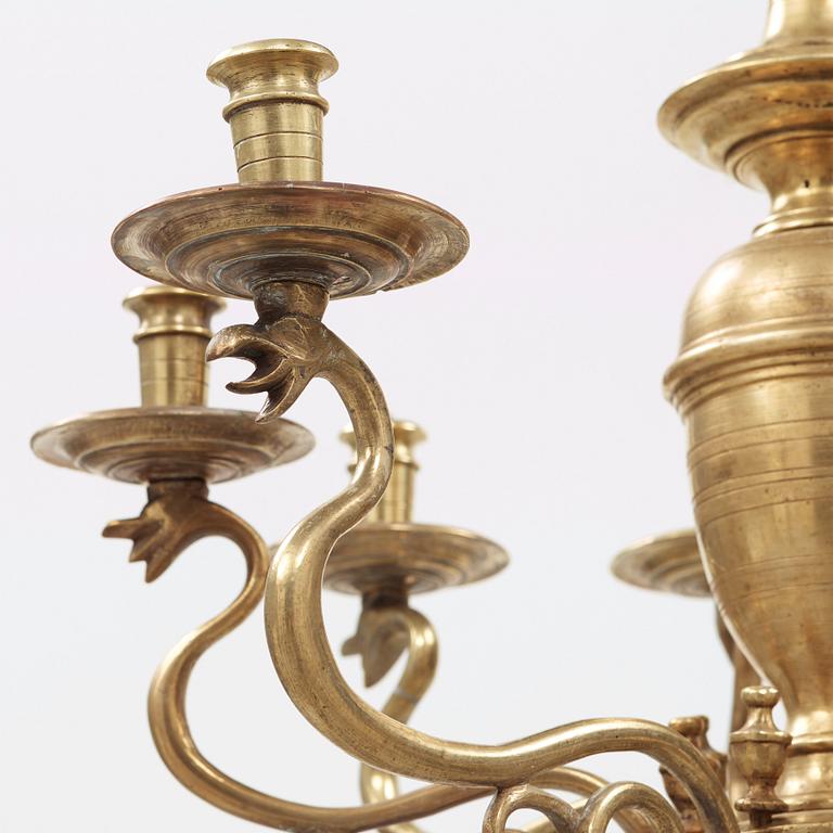 A 19th century eight-light brass chandelier in the manner of Hans Rogiers van Harelbeke.
