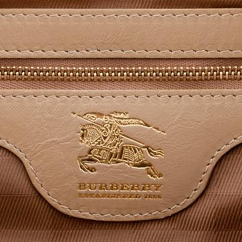 BURBERRY, a beige leather weekend bag.
