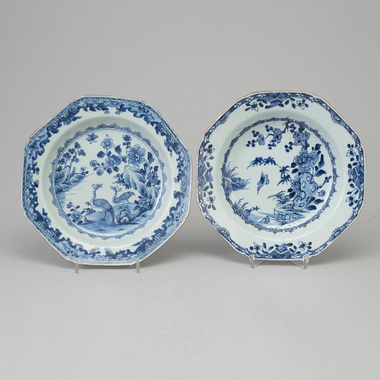 Two blue and white dishes and two cups with dishes, Qing dynasty, Qianlong (1736-95) and Kangxi (1662-1722).