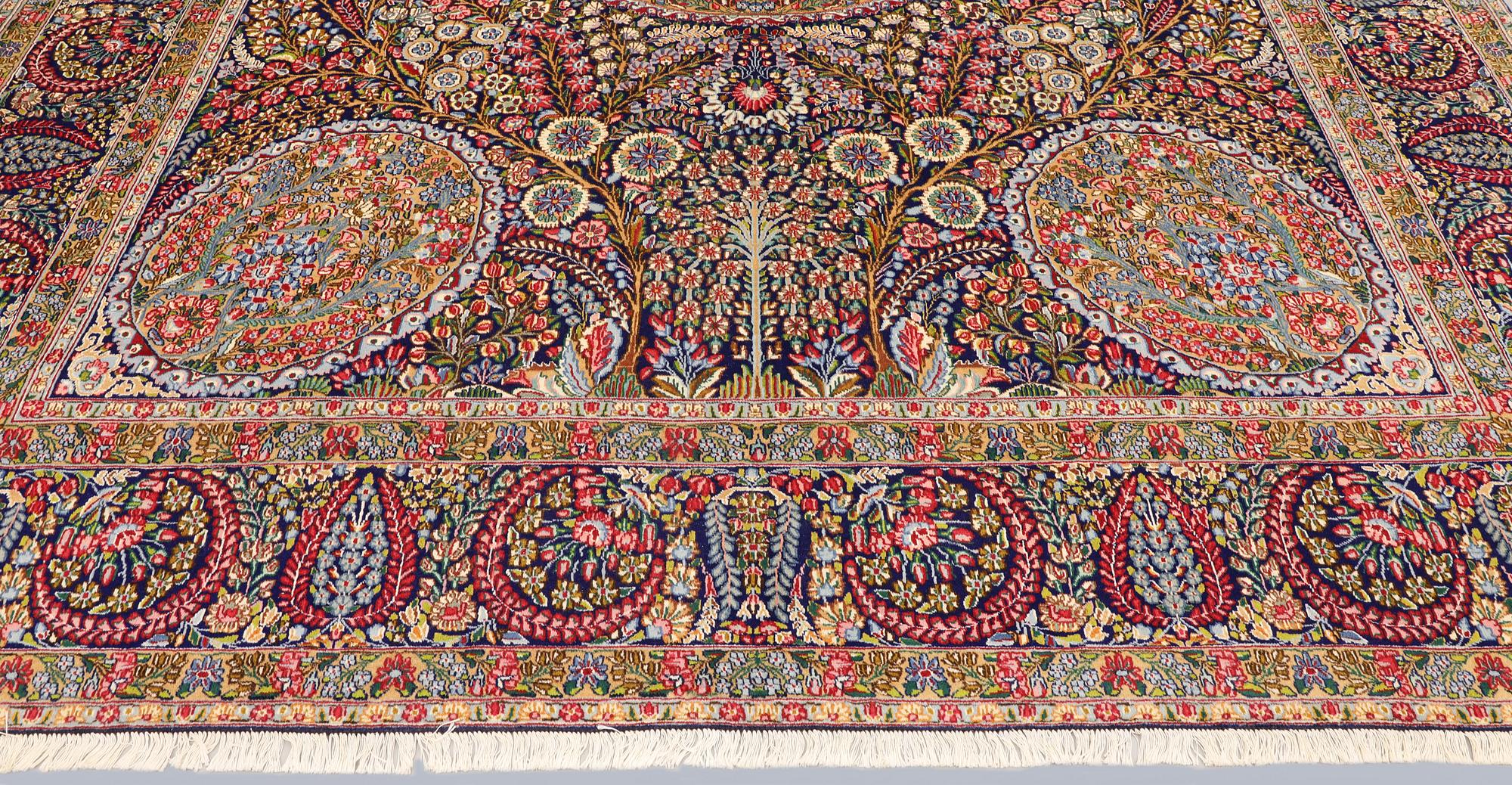 A carpet, Kirman Laver, 'Millefleur', c. 393 x 300 cm.