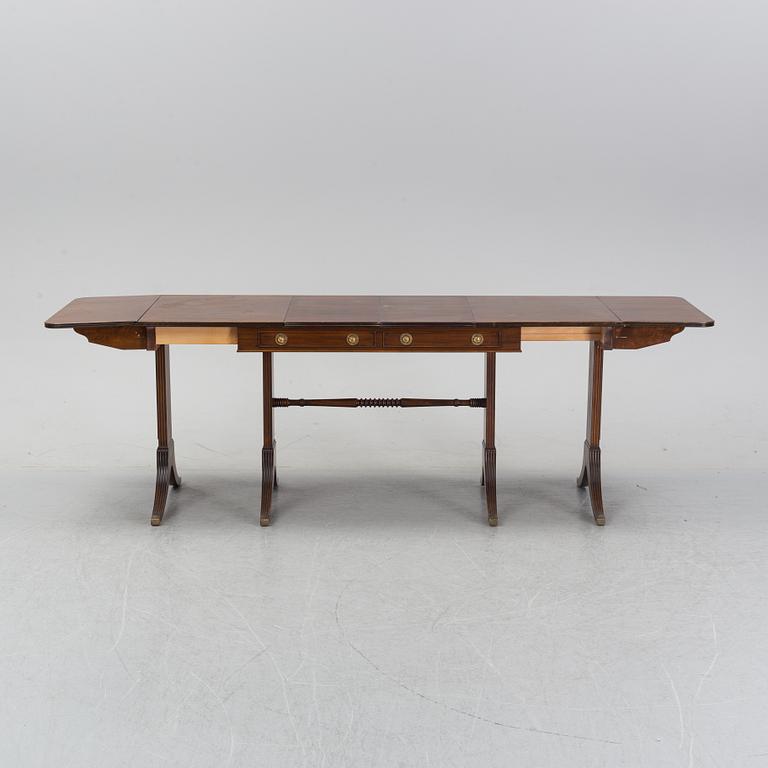 A mahogany dining table with folding and additional leaves, Nordiska Kompaniet, designed 1945.