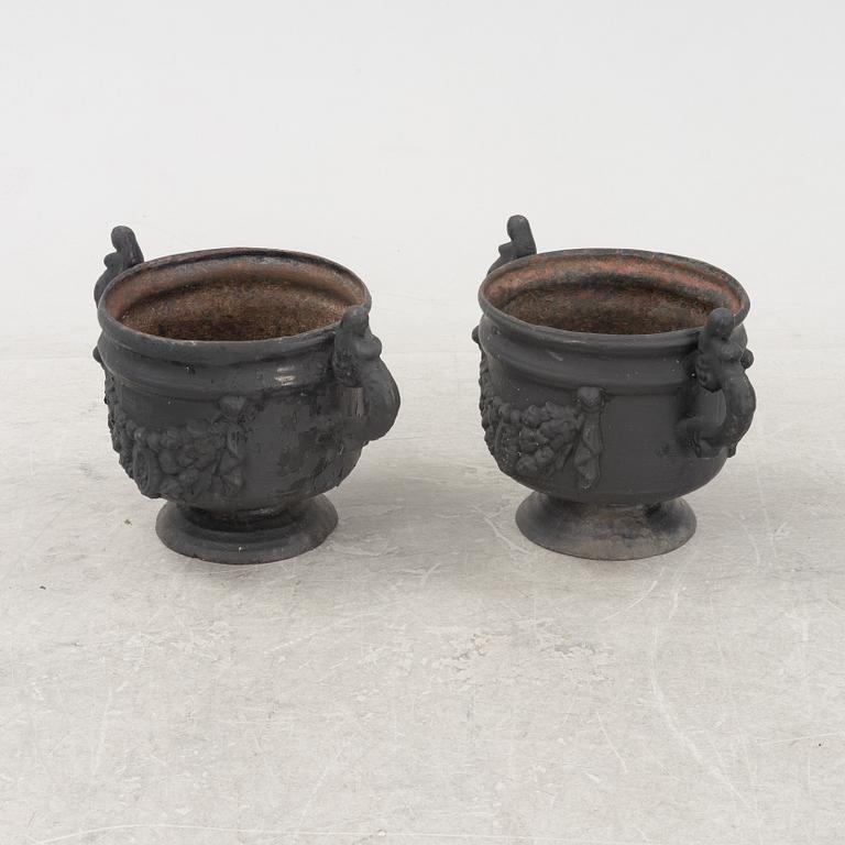A pair of cast-iron urns from Stafsjö Bruk, 20th Century.