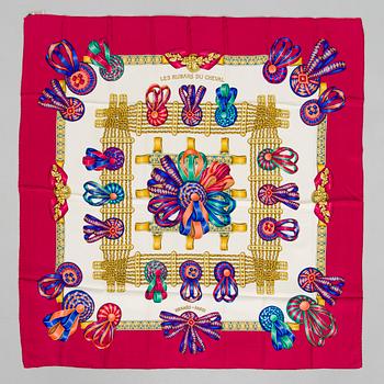 Hermès, a 'Les Rubans du Cheval' silk scarf.