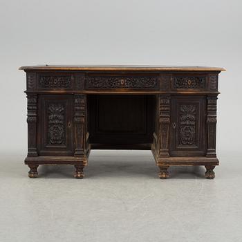 A Renaissance revival free standing writing desk, late 19th century.