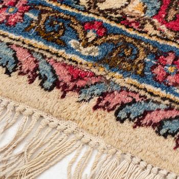 A carpet, old Kerman, approx. 314 x 210 cm.