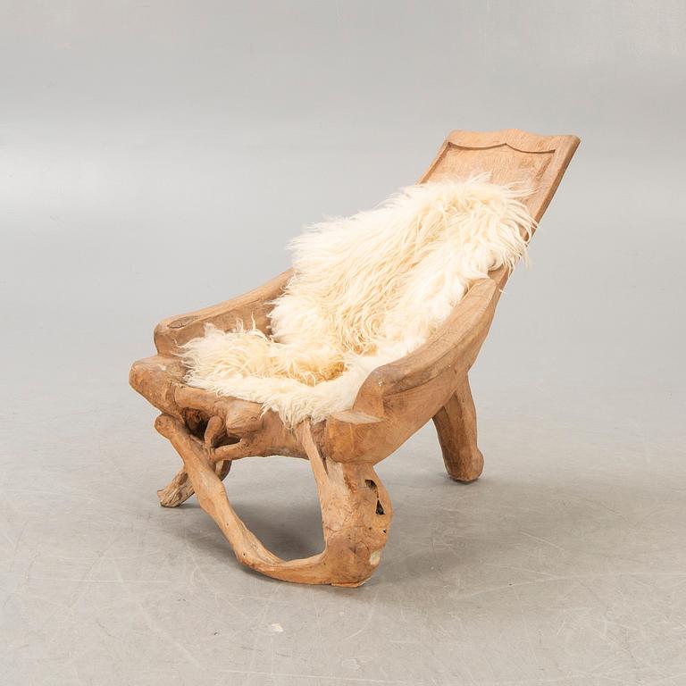 A late 20th century wooden armchair.