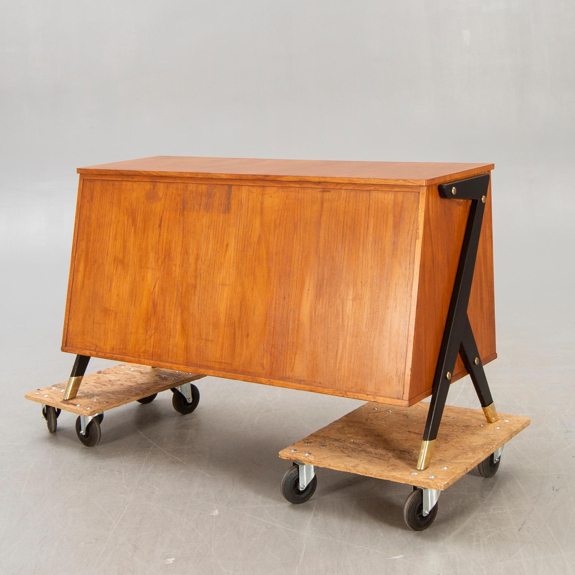 A mid 1900s teak counter.