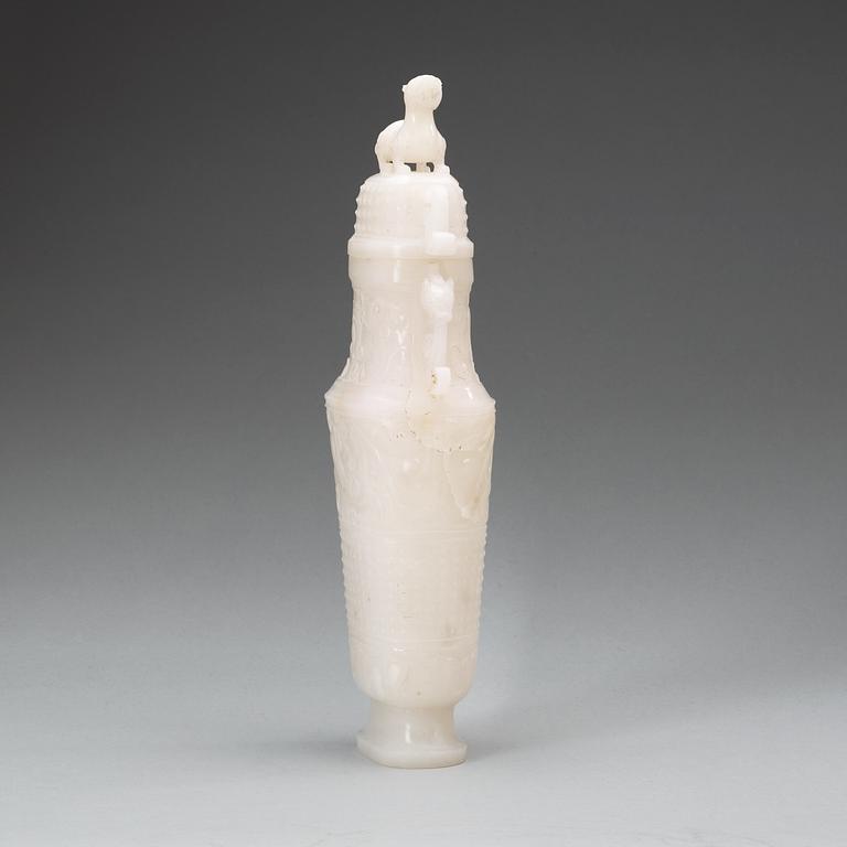 A archaistic carved white stone vase with cover.