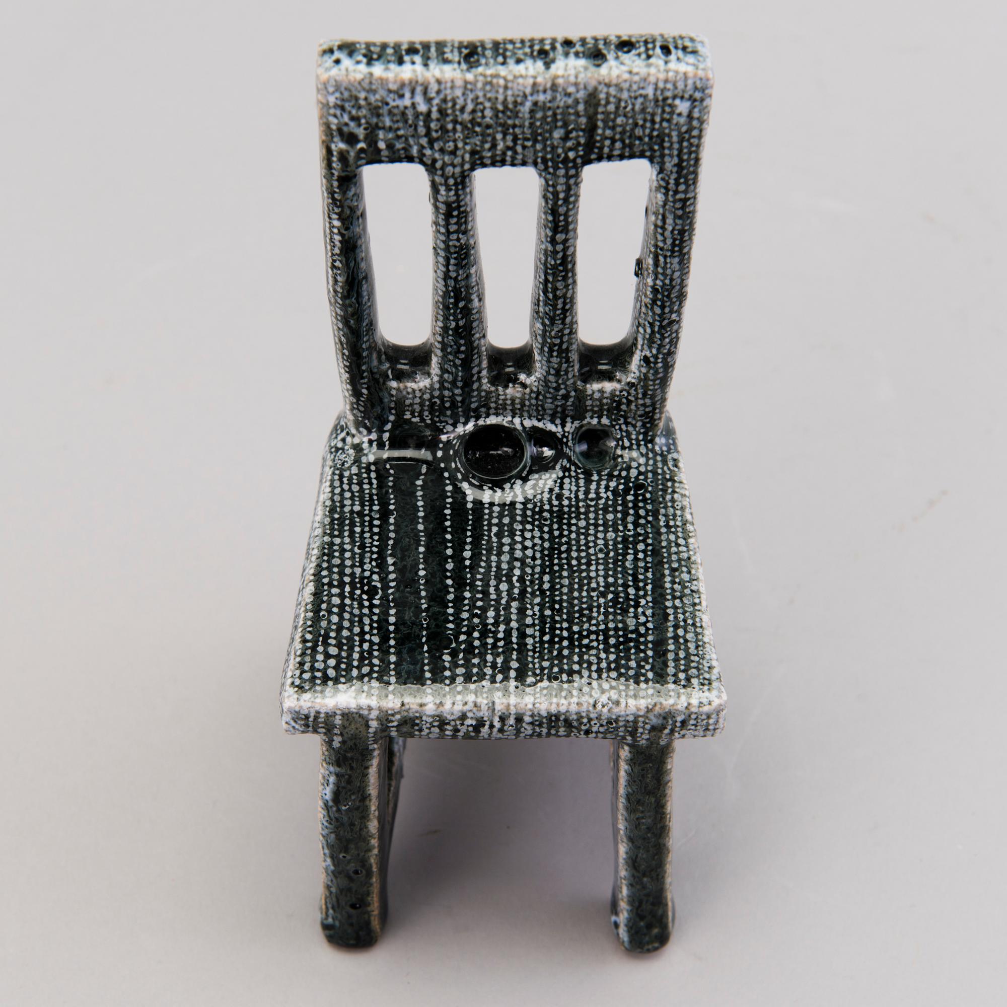 HEINI RIITAHUHTA, a porcelain miniature sculpture 'Chair' signed Heini Riitahuhta.