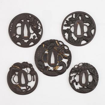 Five iron tsubas with dragon motives, probably 19th Century.