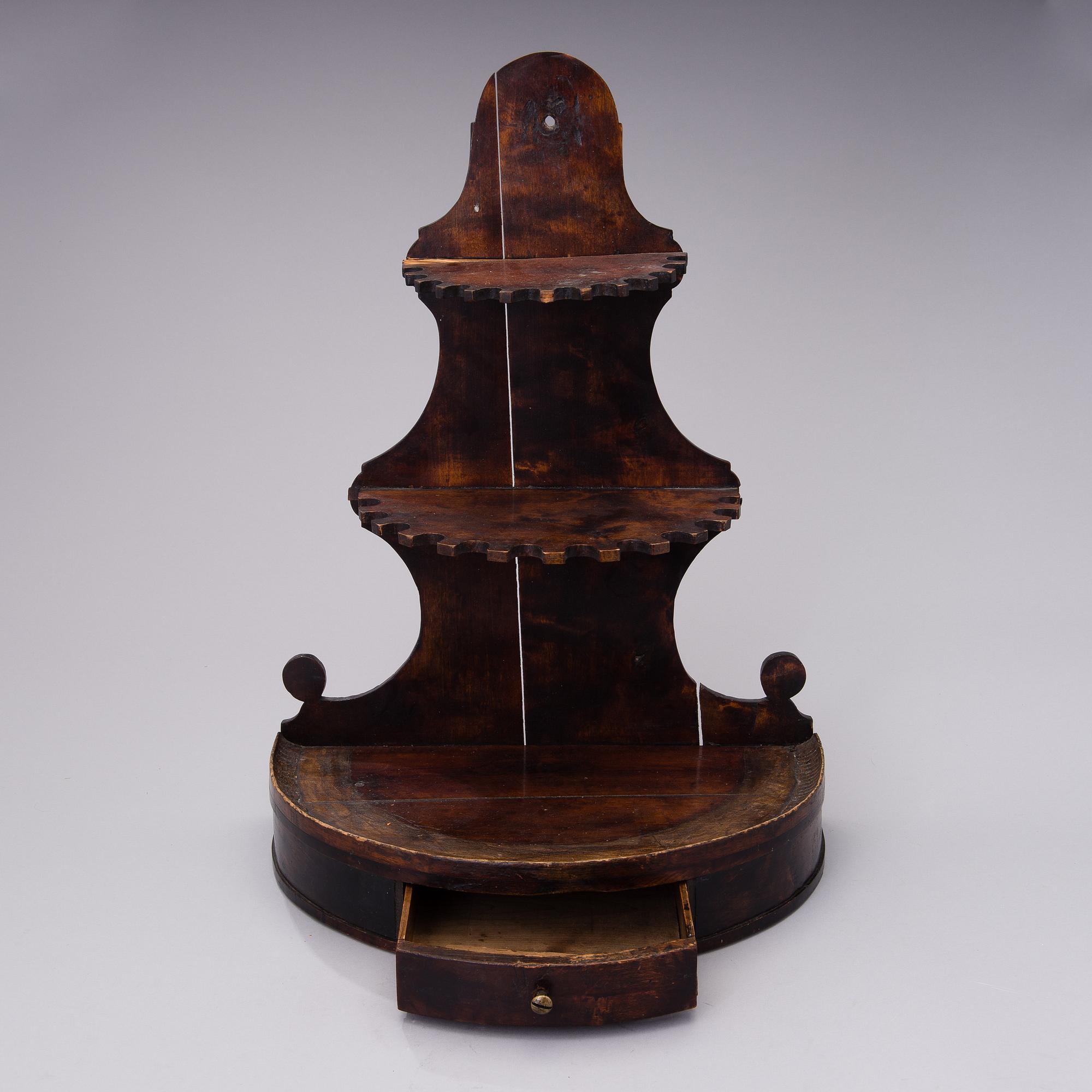 19th century pipes on a wooden pipe rack.