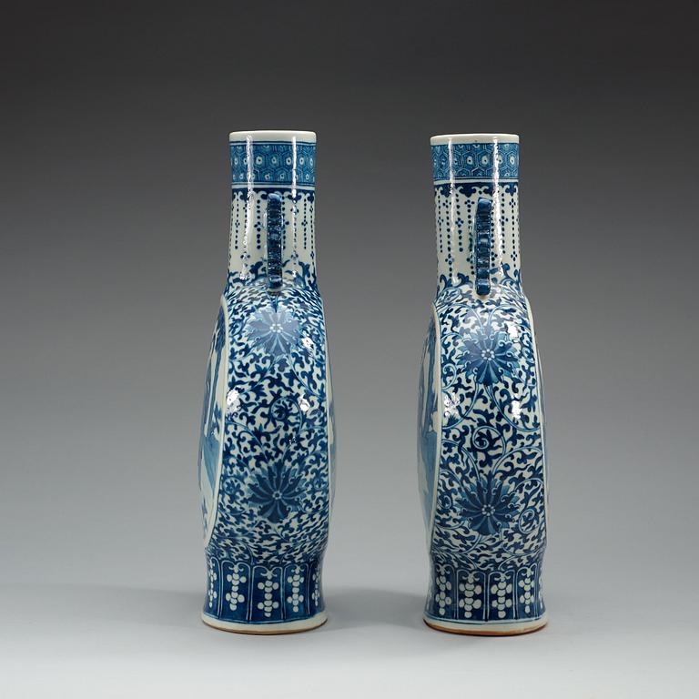 A pair of large blue and white moon flasks, late Qing dynasty (1644-1912), with Kangxi four character mark.