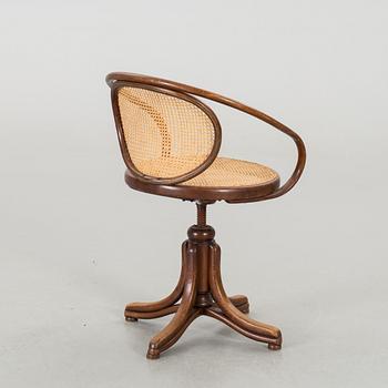 A BENTWOOD DESK CHAIR.