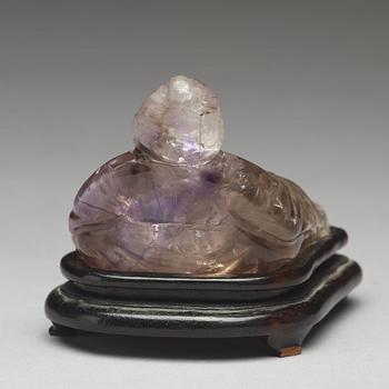 A Chinese quartz figurine of one of the immortals.