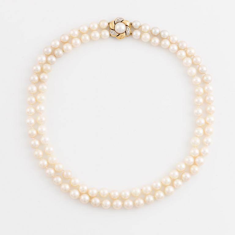 Two strand cultured pearl necklace, clasp 18K gold with half pearl and eight cut diamonds.