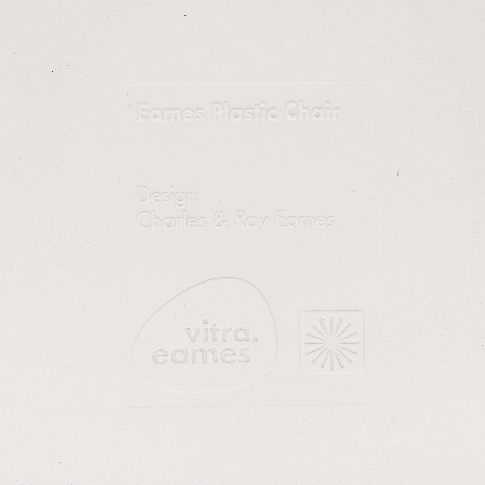 A 'Plastic chair DSW' by Charles and Ray Eames for Vitra.