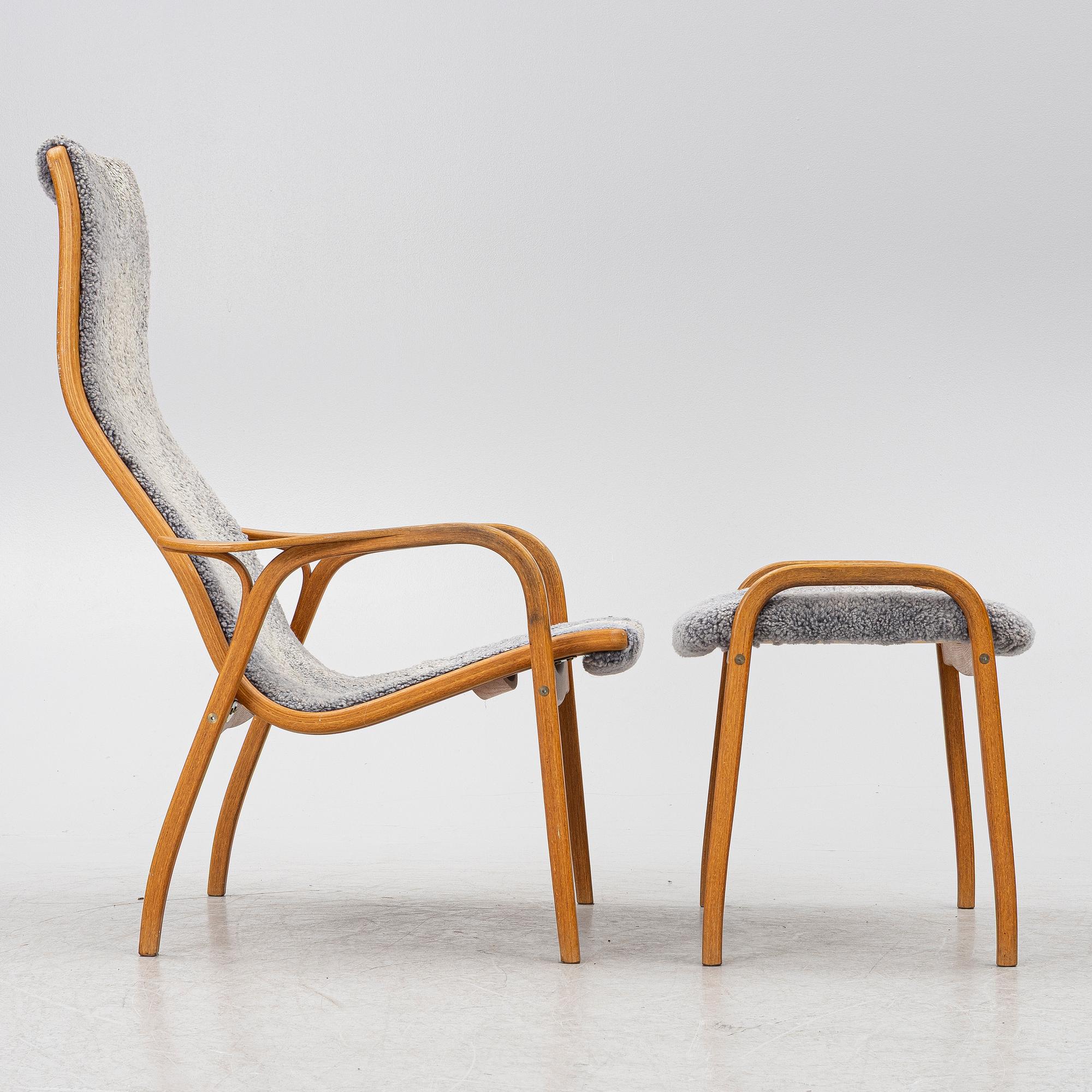Yngve Ekström, a 'Lamino' armchair with ottoman and sidetable, Swedese, Sweden, 21st century.